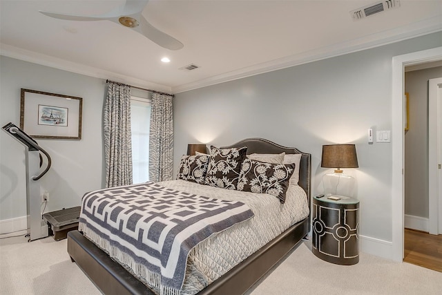 bedroom with light carpet, ornamental molding, and ceiling fan