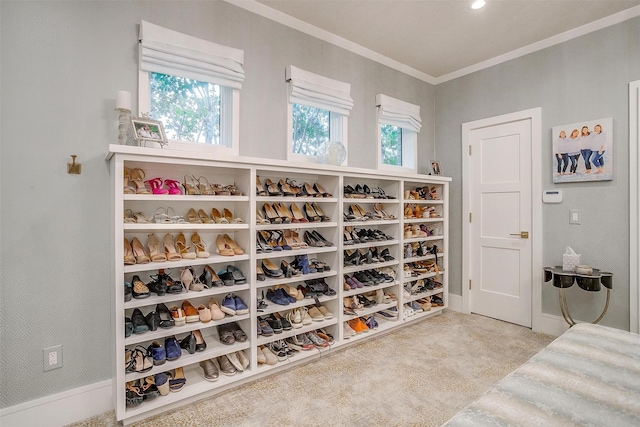 spacious closet featuring light carpet