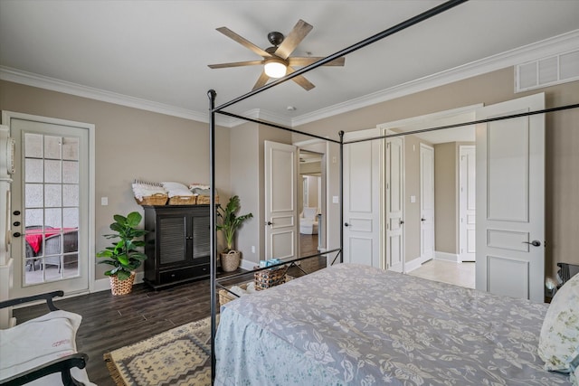 bedroom with ceiling fan, ornamental molding, and wood-type flooring