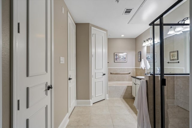 bathroom with vanity, separate shower and tub, and tile patterned floors