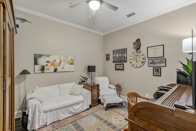 living room featuring crown molding, hardwood / wood-style floors, and ceiling fan