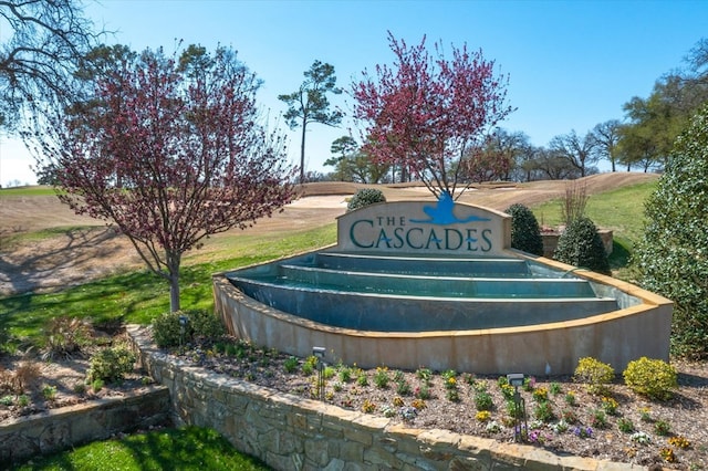 community / neighborhood sign featuring a rural view