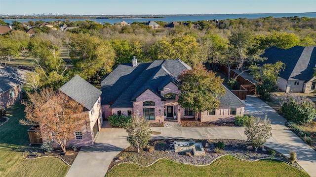 birds eye view of property featuring a water view