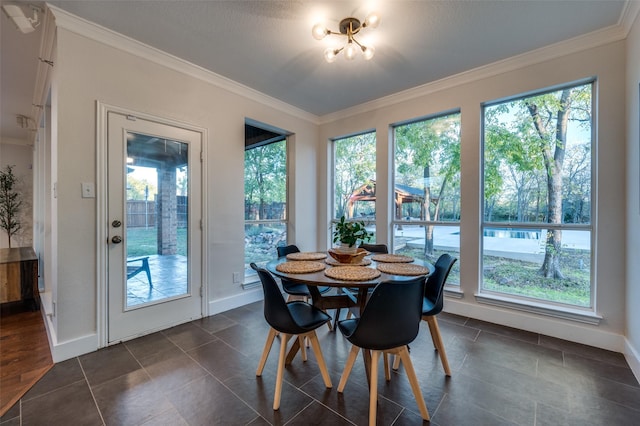 dining area with plenty of natural light and ornamental molding