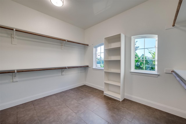 spacious closet featuring tile patterned floors