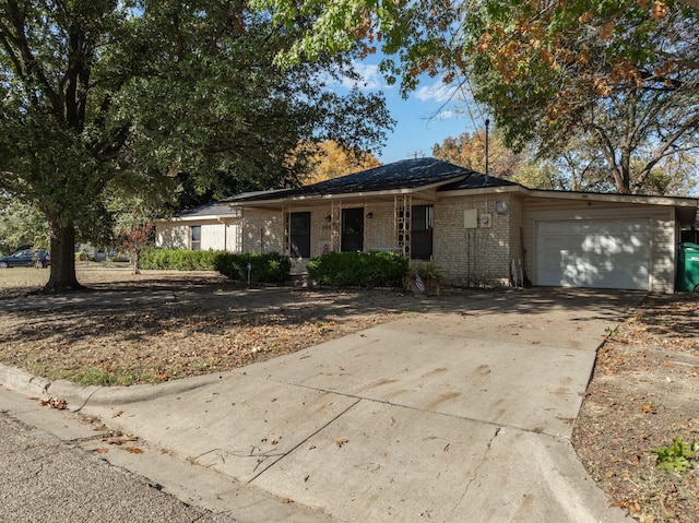 ranch-style home featuring a garage