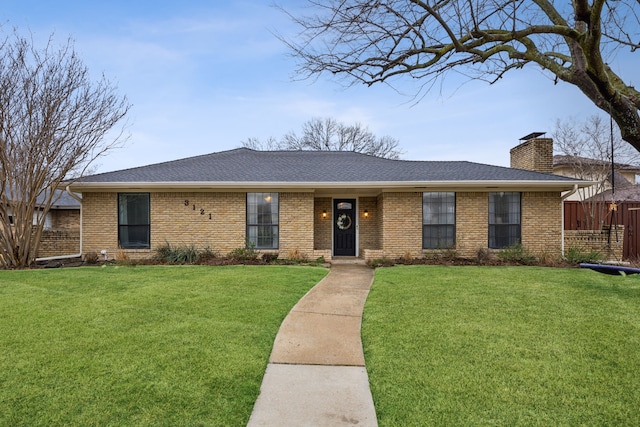 single story home with a front lawn