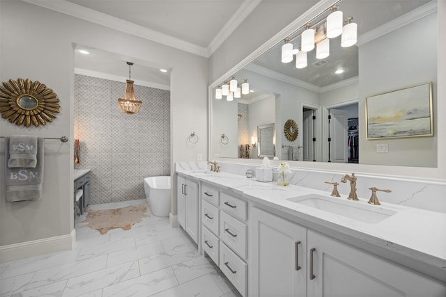 bathroom featuring crown molding, vanity, and a bathing tub