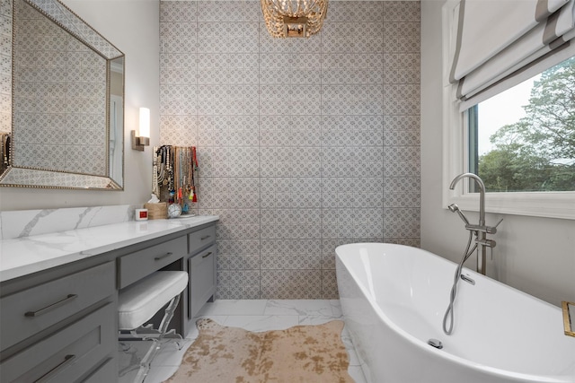 bathroom with vanity and a bathing tub