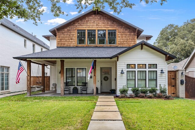 view of front of house featuring a front lawn and a porch