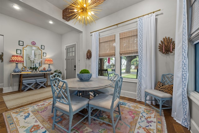 dining room featuring an inviting chandelier and hardwood / wood-style floors