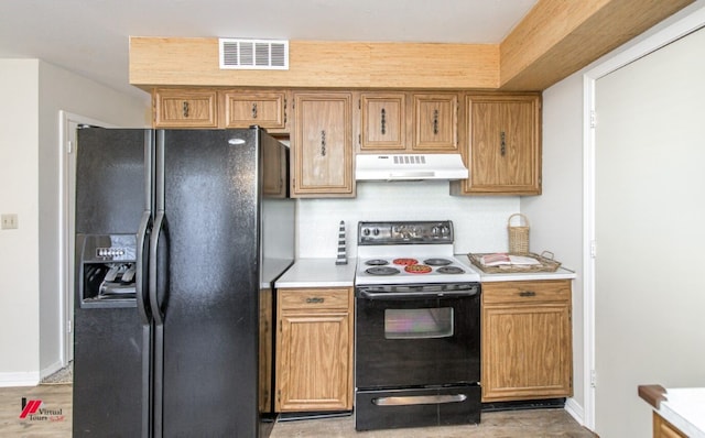 kitchen featuring light hardwood / wood-style flooring and black appliances