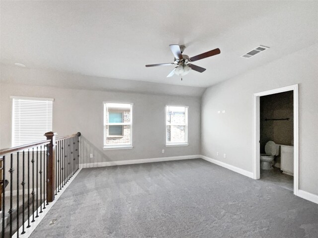 carpeted empty room featuring ceiling fan