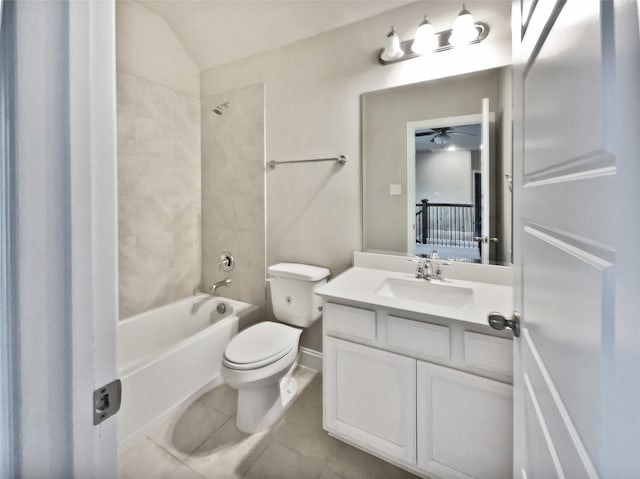 full bathroom featuring ceiling fan, tiled shower / bath combo, tile patterned flooring, toilet, and vanity