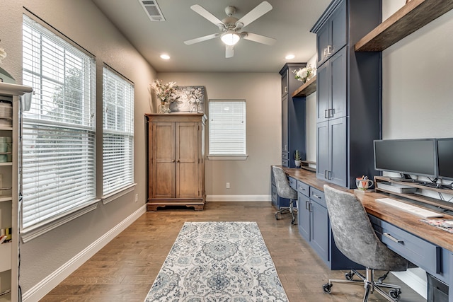 office space featuring light hardwood / wood-style floors and ceiling fan