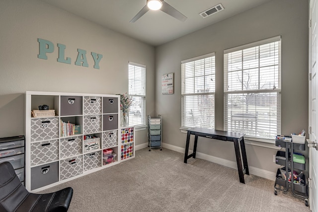 playroom featuring ceiling fan and light colored carpet