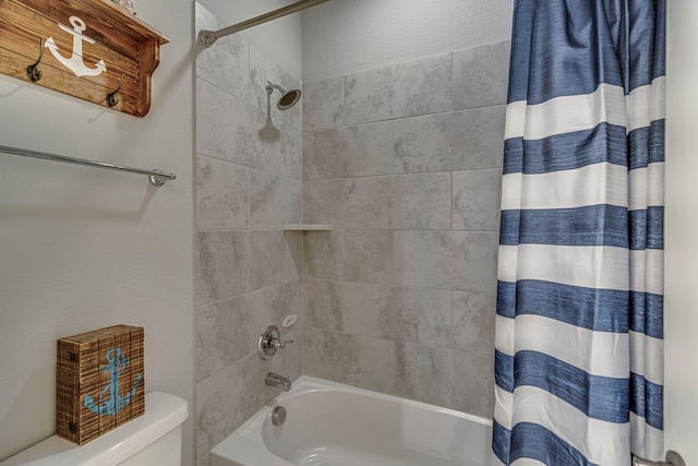 bathroom featuring toilet and shower / tub combo