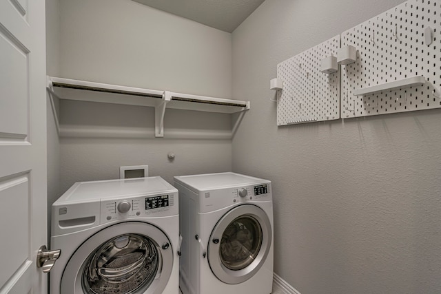 washroom featuring separate washer and dryer