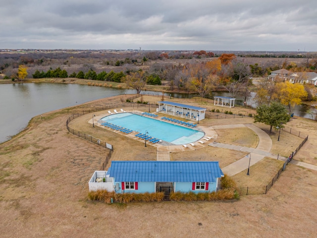 view of pool with a water view