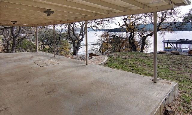 view of patio with a water view