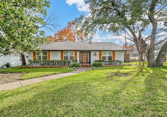 ranch-style house with a front lawn