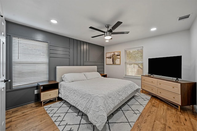 bedroom featuring ceiling fan and light hardwood / wood-style flooring