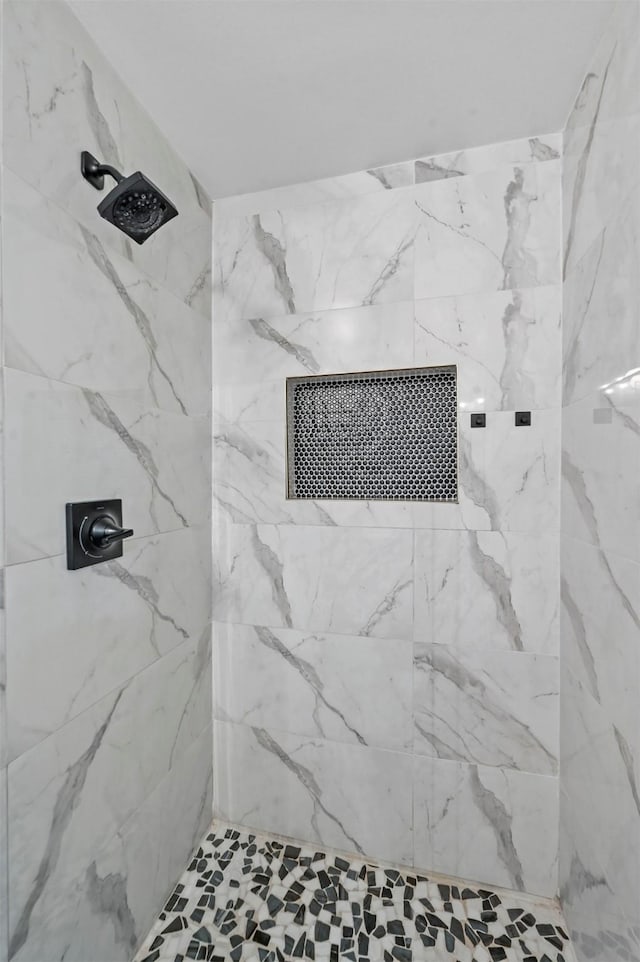 bathroom featuring tiled shower