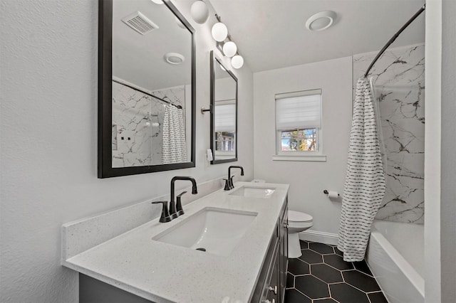 full bathroom with tile patterned floors, vanity, toilet, and shower / bathtub combination with curtain