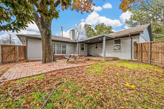 rear view of house featuring a patio area