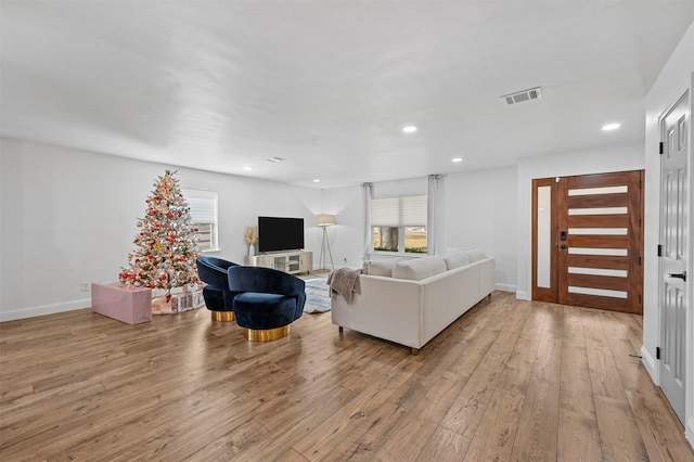 living room with light hardwood / wood-style floors