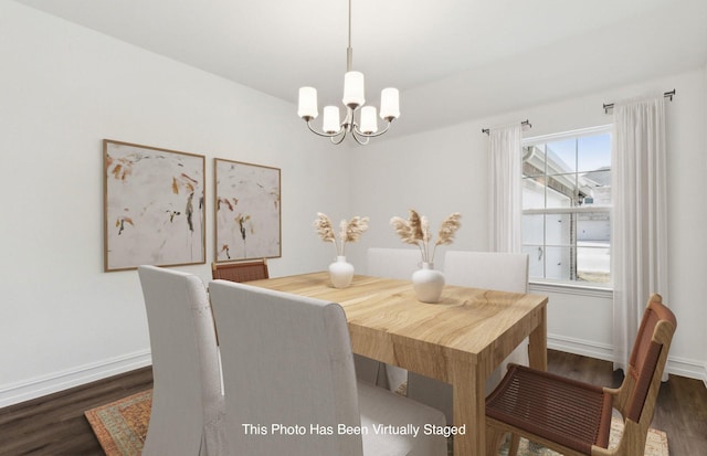 dining room featuring an inviting chandelier, dark wood-type flooring, and a healthy amount of sunlight