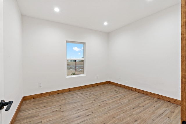 spare room featuring light hardwood / wood-style floors