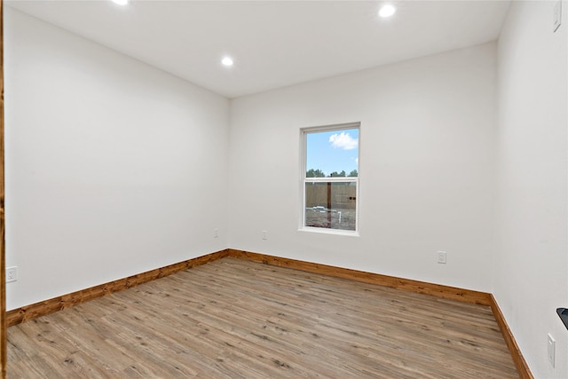 unfurnished room with light hardwood / wood-style floors