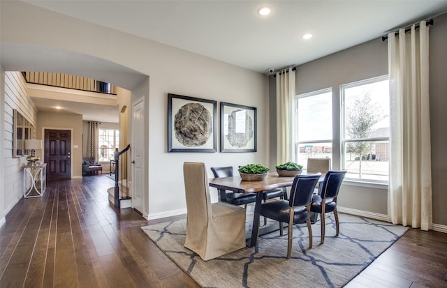 dining space featuring dark wood-type flooring