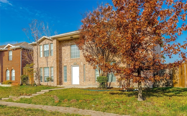 view of front of home with a front lawn