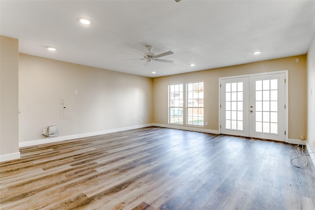 spare room featuring ceiling fan, light hardwood / wood-style flooring, and french doors