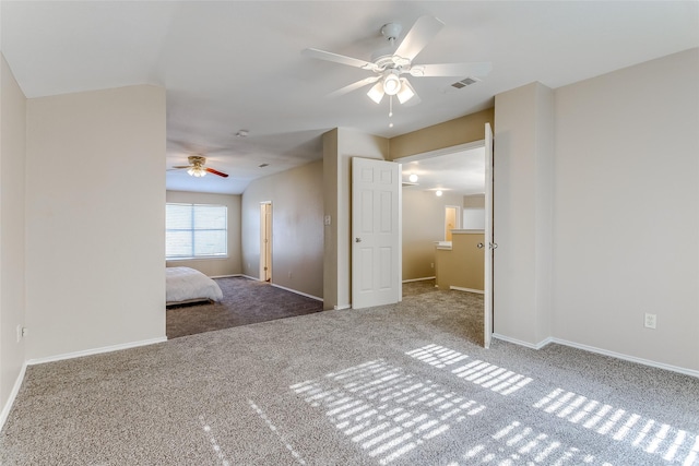 unfurnished bedroom featuring carpet flooring and ceiling fan