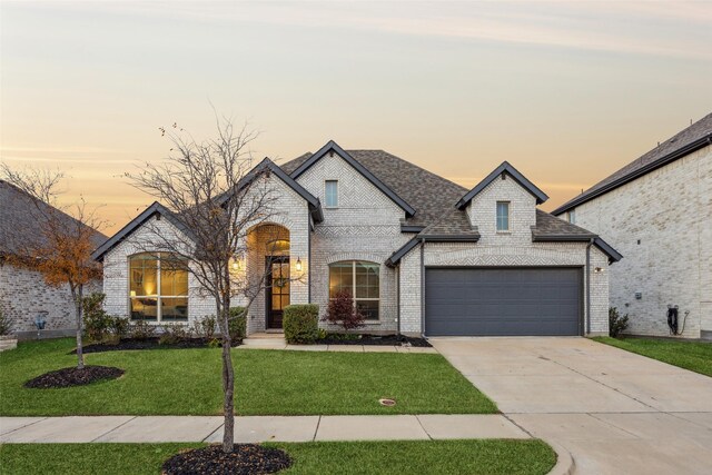 french country home with a yard