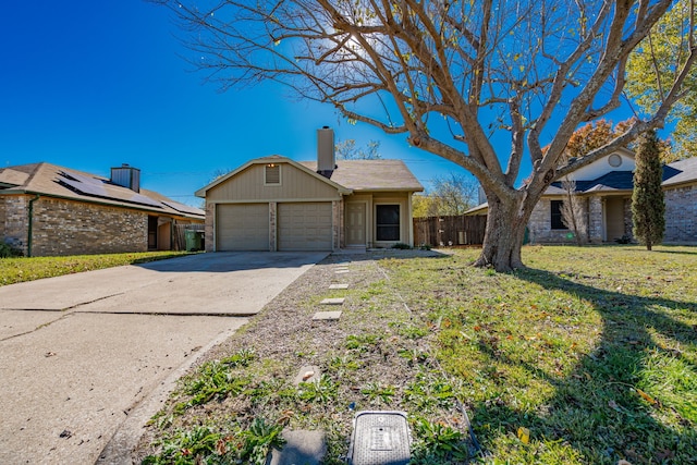 ranch-style house featuring a front yard and a garage