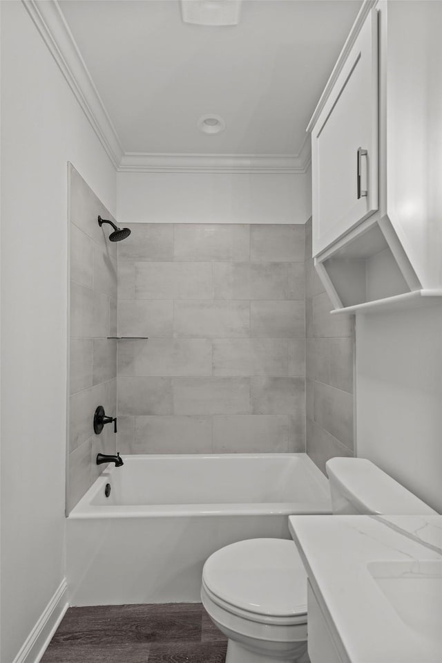 full bathroom featuring tiled shower / bath combo, crown molding, hardwood / wood-style floors, and toilet