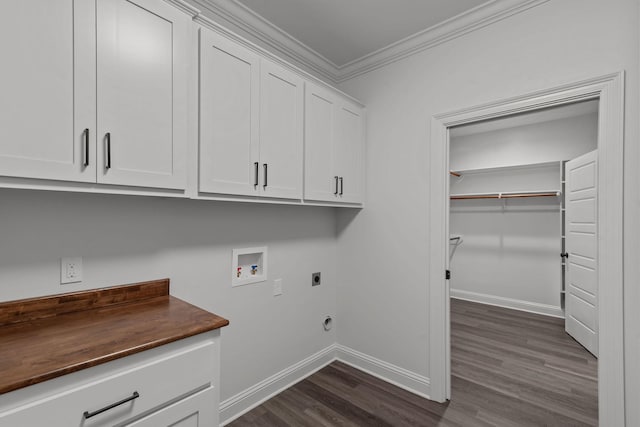 laundry room featuring crown molding, cabinets, dark hardwood / wood-style flooring, washer hookup, and hookup for an electric dryer