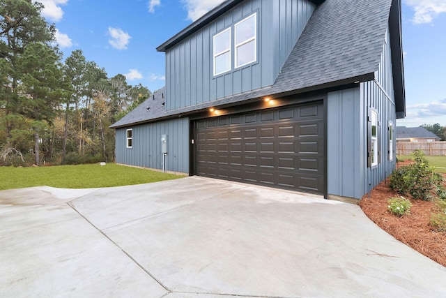 view of property exterior featuring a yard and a garage