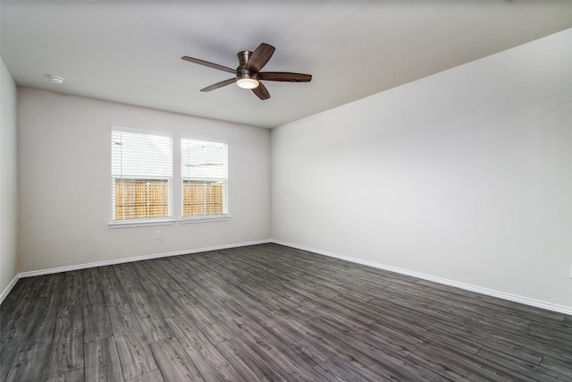 unfurnished room featuring ceiling fan and dark hardwood / wood-style floors