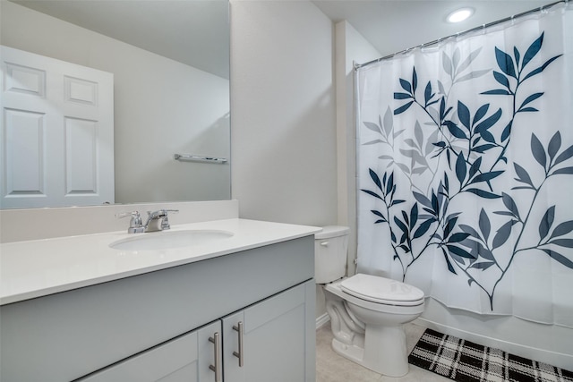 full bathroom with tile patterned floors, vanity, shower / tub combo, and toilet