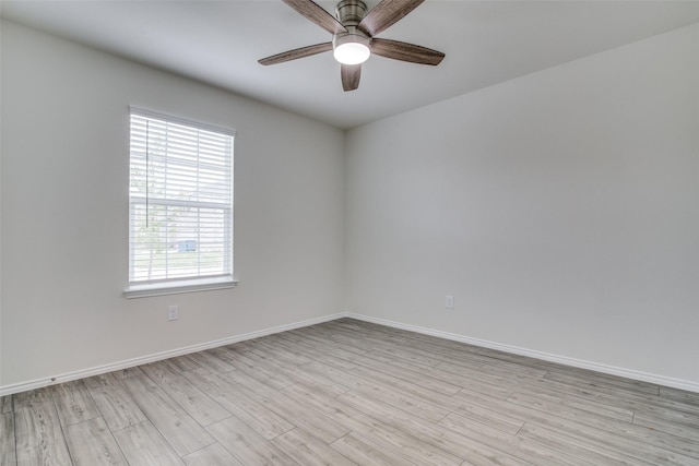 spare room with ceiling fan and light hardwood / wood-style floors