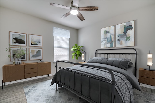 bedroom featuring ceiling fan and light hardwood / wood-style floors