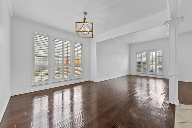 interior space featuring an inviting chandelier, plenty of natural light, and decorative columns