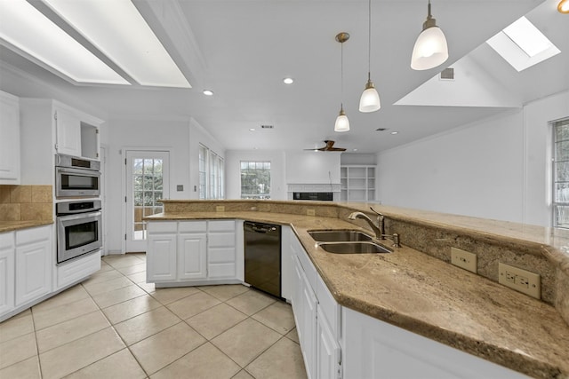 kitchen featuring white cabinetry, sink, and black dishwasher