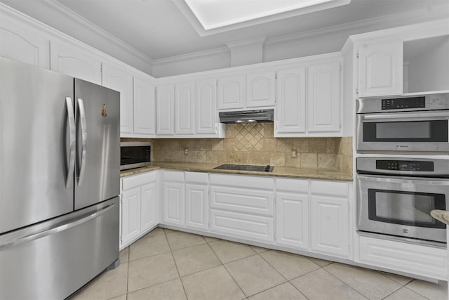 kitchen with appliances with stainless steel finishes, light tile patterned floors, and white cabinets