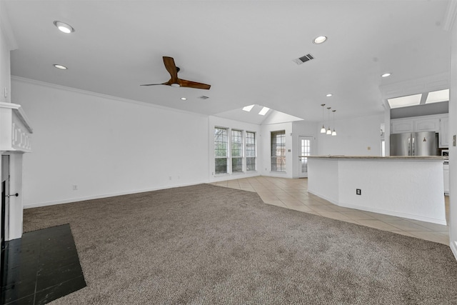 unfurnished living room with ceiling fan, light colored carpet, lofted ceiling, and crown molding